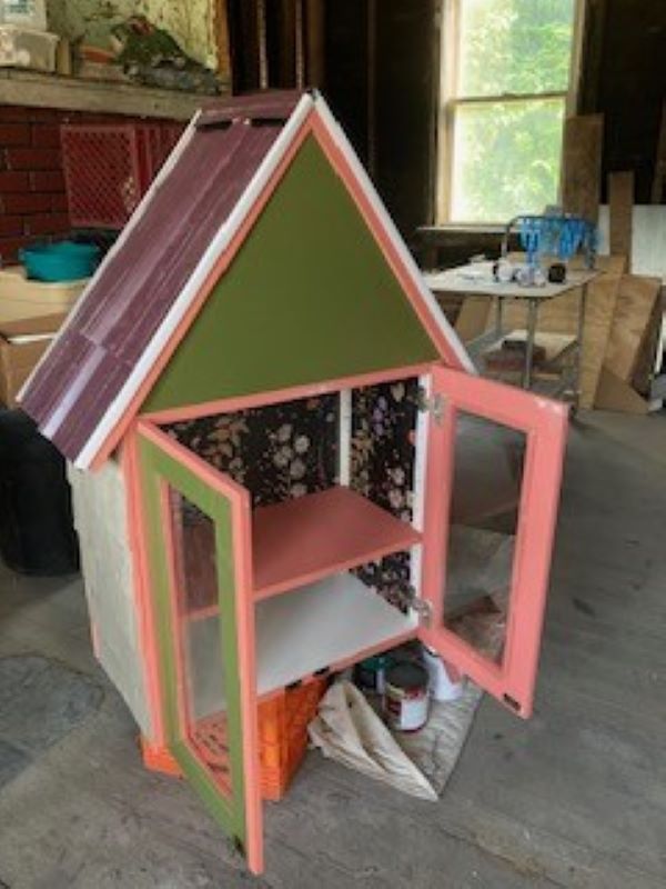 library has a roof thanks to a handy neighbor