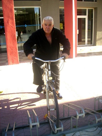 The poet on a parked bike